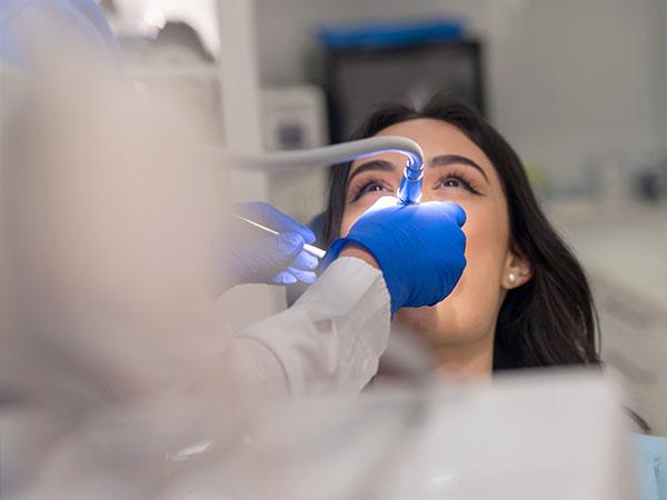 Woman undergoing dental procedure